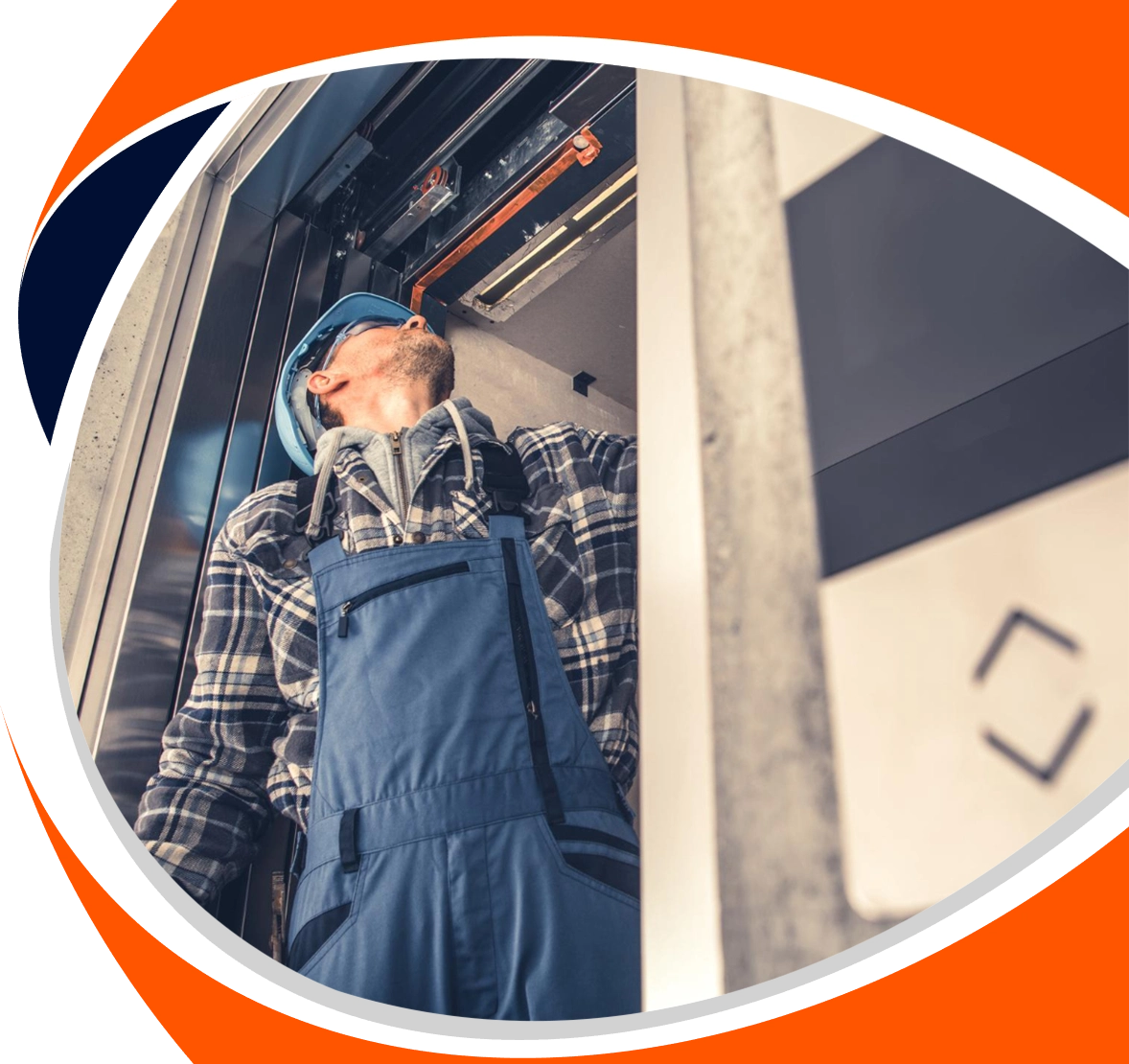 Home 9 http://A%20technician%20performing%20a%20detailed%20elevator%20service%20in%20Chennai,%20looking%20up%20to%20inspect%20the%20mechanics%20inside%20the%20top%20of%20a%20lift%20car.